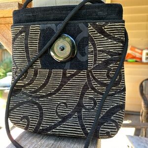 L. O Neill design tapestry bag. Rope strap 9” by 8.5” zip top closure heavy duty